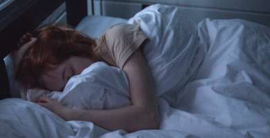 Woman sleeping in bed