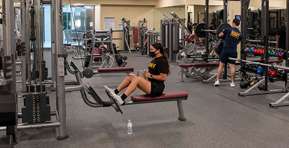 Service members working out in the weight room