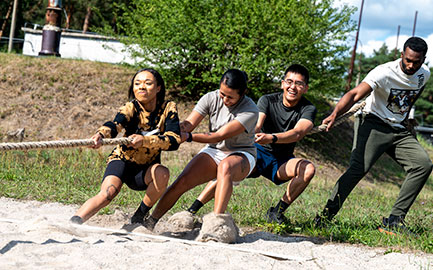 Diverse team in tug of war challenge
