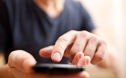Man with a mobile phone in his hand