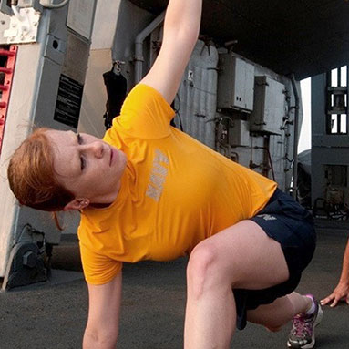 Servicemember doing yoga outside