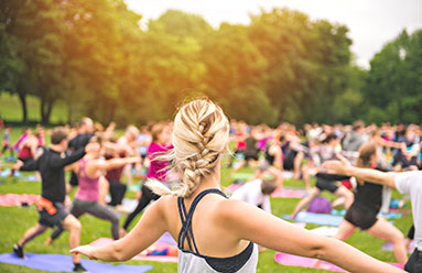 Group of people doing exercise in an outdoor space